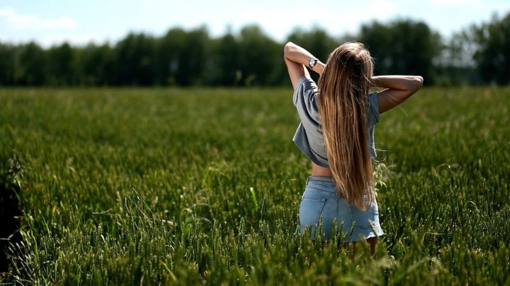 Beautiful Woman Playing With Hair in The Wind